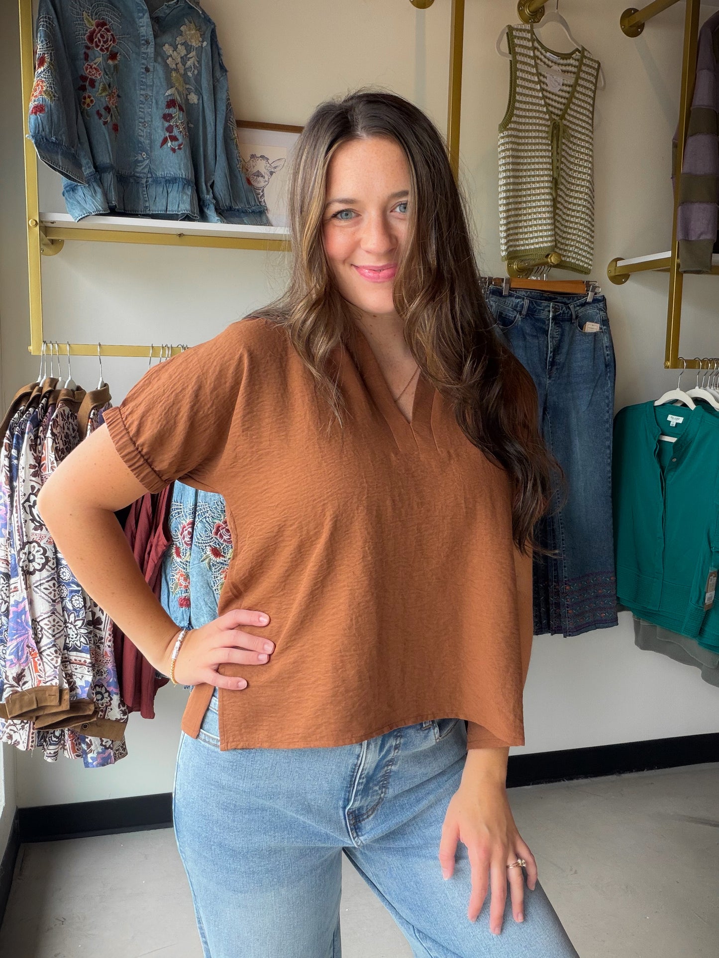 The Brown Johnny Collar Blouse by Staccato is a wardrobe staple that works harder than it looks. The distinctive Johnny collar adds a fashion-forward edge to a clean, solid silhouette — making it easy to dress up or keep casual without a second thought.

Short sleeves with an elastic finish give it a relaxed, polished fit, while the 100% Polyester fabric keeps it lightweight, wrinkle-resistant, and easy to care for. A rich brown tone makes it endlessly versatile — pair it with denim, trousers, or your 