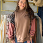 Meet the Mocha Mock Neck Accent Sweatshirt from Oli &amp; Hali, an effortless pullover made for relaxed everyday style. The funnel neckline and drop-shoulder construction create an easy, laid-back silhouette, while the mineral-wash finish gives the mocha color a lived-in look. Pair it with denim, leggings, or joggers for an outfit that feels comfortable and pulled together.

Why you’ll love it:

Mock neck with funnel-neck detail
Relaxed drop-shoulder silhouette
Easy pullover design
Mineral-wash finish
Relax