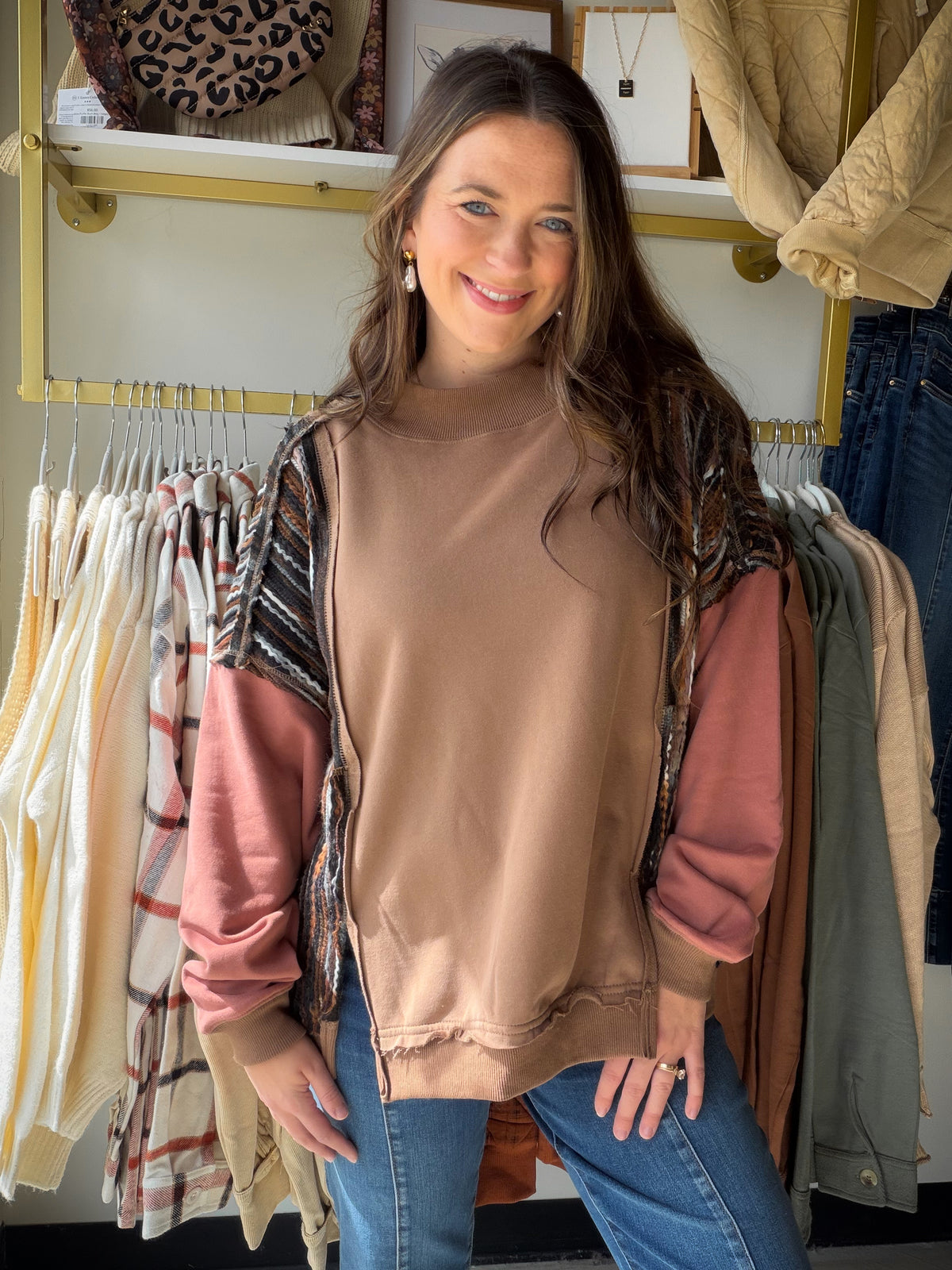 Meet the Mocha Mock Neck Accent Sweatshirt from Oli &amp; Hali, an effortless pullover made for relaxed everyday style. The funnel neckline and drop-shoulder construction create an easy, laid-back silhouette, while the mineral-wash finish gives the mocha color a lived-in look. Pair it with denim, leggings, or joggers for an outfit that feels comfortable and pulled together.

Why you’ll love it:

Mock neck with funnel-neck detail
Relaxed drop-shoulder silhouette
Easy pullover design
Mineral-wash finish
Relax