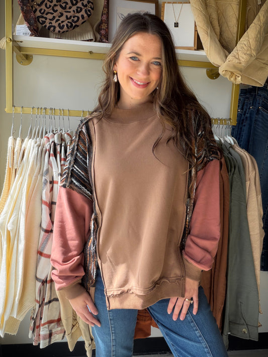 Meet the Mocha Mock Neck Accent Sweatshirt from Oli &amp; Hali, an effortless pullover made for relaxed everyday style. The funnel neckline and drop-shoulder construction create an easy, laid-back silhouette, while the mineral-wash finish gives the mocha color a lived-in look. Pair it with denim, leggings, or joggers for an outfit that feels comfortable and pulled together.

Why you’ll love it:

Mock neck with funnel-neck detail
Relaxed drop-shoulder silhouette
Easy pullover design
Mineral-wash finish
Relax