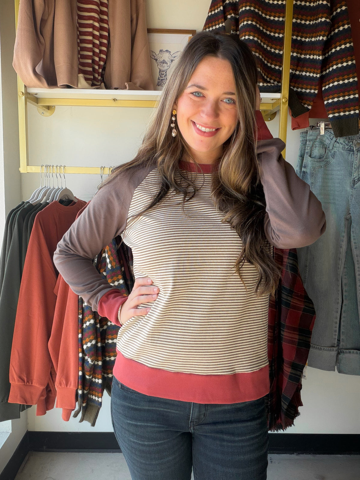 Warm, textured, and endlessly wearable, the Brown Stripe Ribbed Crewneck from Staccato is the kind of top you reach for without thinking twice. Its color-blocked pinstripe design brings gentle movement to a rich brown palette, and the ribbed texture adds just enough depth to make an everyday crewneck feel special.

Why You'll Love It

Classic crew neckline with long sleeves
Color-blocked pinstripe detail in warm brown tones
Ribbed knit texture for subtle dimension
An easy long-sleeve knit that dresses up or