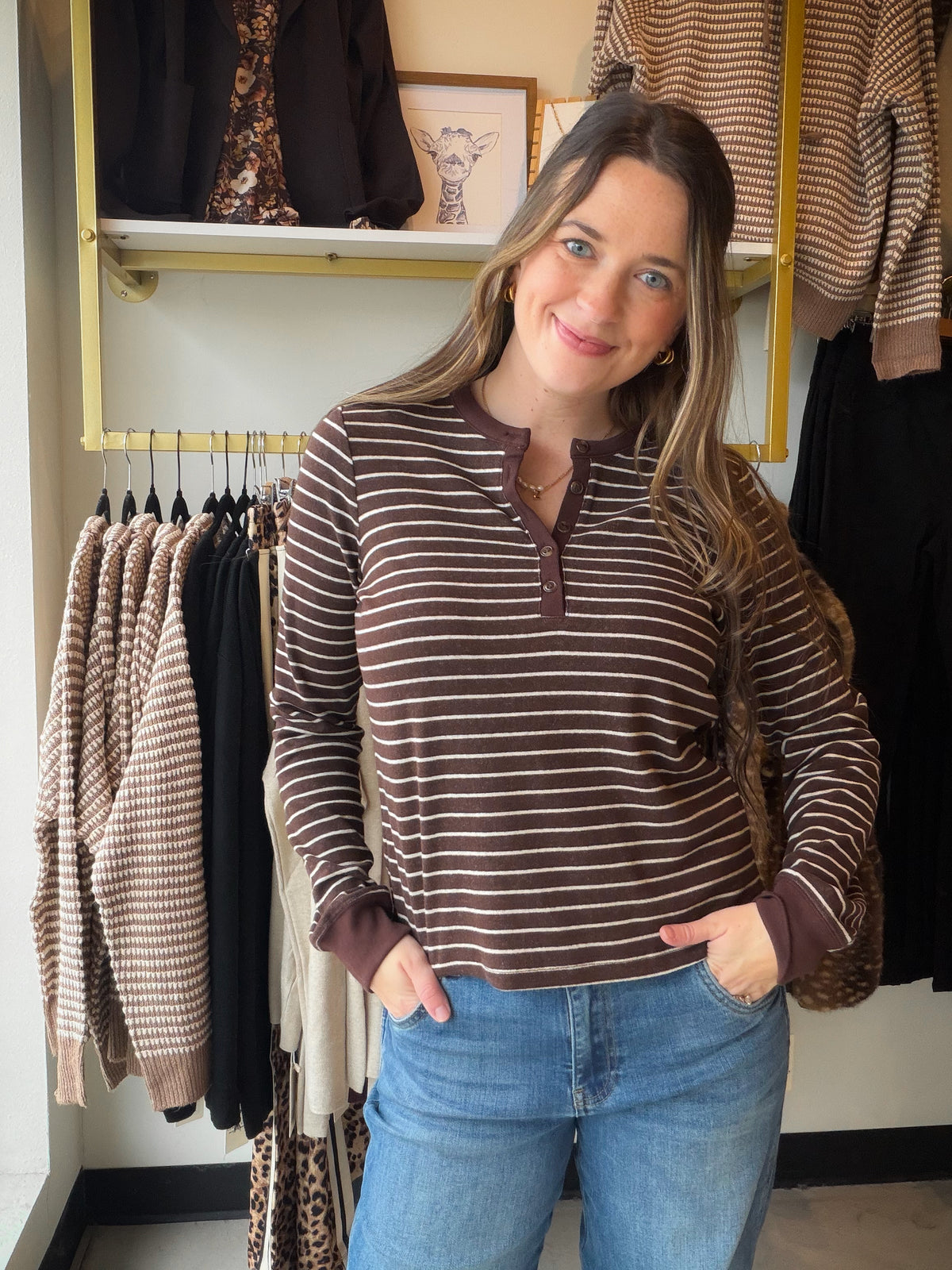 Thread &amp; Supply

Made in our incredibly soft dream knit fabric, this classic long sleeve is featured with a henley button neckline and contrast ribbing.

Long-sleeved top
Half button front closure
Contrast ribbing
Measurements for a size small:

Length: 22.5"
Chest: 18"
Sleeve length: 25"
Sweep: 18"
Fabric Content/Care:&nbsp;

62% Polyester
33% Viscose
5% Elastane
Machine Wash Cold
