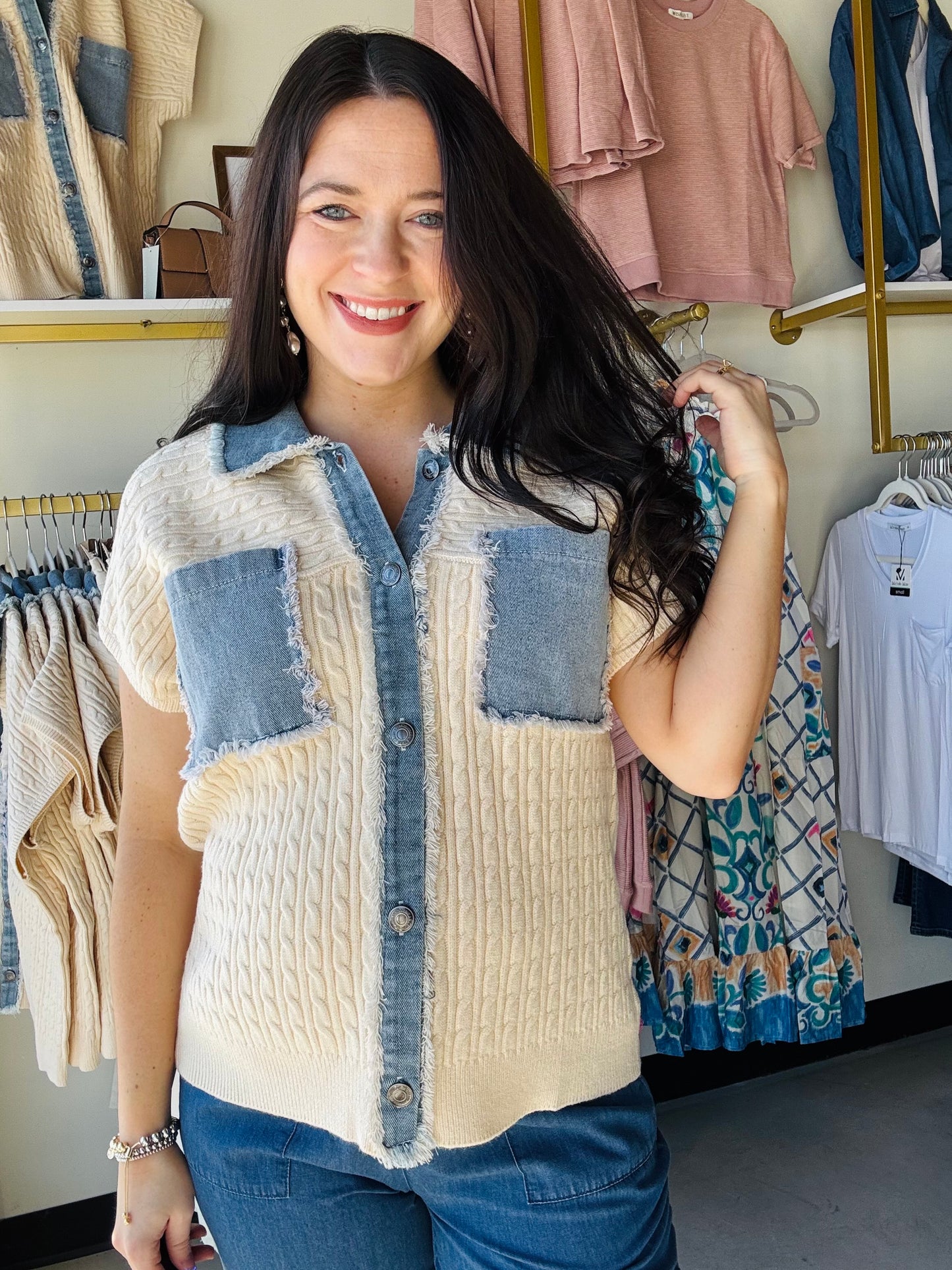 Anniewear

Effortlessly blend textures with this versatile cable knit top. Featuring a distressed denim contrast panel, button-down front, and practical patch pocket, it's designed for relaxed comfort. The short dolman sleeves add a contemporary touch while the relaxed fit ensures all-day wearability. Perfect for layering or wearing solo, this mixed-media piece brings dimension and style to your everyday wardrobe.