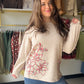 A classic sweatshirt gets an artisanal upgrade with this pullover from Tru Luxe Jeans. Chainstitch embroidery worked across the front adds handcrafted character to an easy, everyday silhouette — cozy meets craft in one effortless layer.

Pullover silhouette for relaxed, everyday wear
Chainstitch embroidery detail across the front
Soft Polyester/Cotton blend for comfortable all-day wear
Available in sizes S–XL