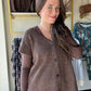 Mustard Seed&nbsp;

Get cozy and cute with this Dark Chocolate Sweater Vest! Featuring functioning buttons and playful cap sleeves, it’s perfect for layering any outfit. The ribbed detailing adds a fun texture twist while keeping things comfy and stylish. Perfect for when you want a little warmth with a lot of charm.