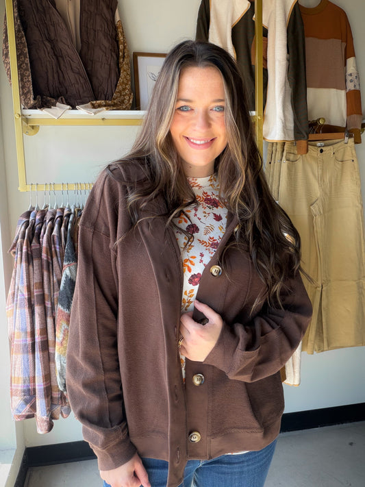 The shacket you’ll live in all season. This rich chocolate hoodie jacket from&nbsp;Doe &amp; Rae blurs the line between shirt and jacket with its oversized silhouette, raw edge detailing, and big button closure — the kind of piece that looks intentional thrown over anything.

Reverse stitch &amp; raw edge details for an on-trend, effortlessly cool finish
Front button closure with large, easy-to-fasten buttons
Oversized fit with drop shoulders — relaxed and flattering
Functional hood for extra warmth and cas