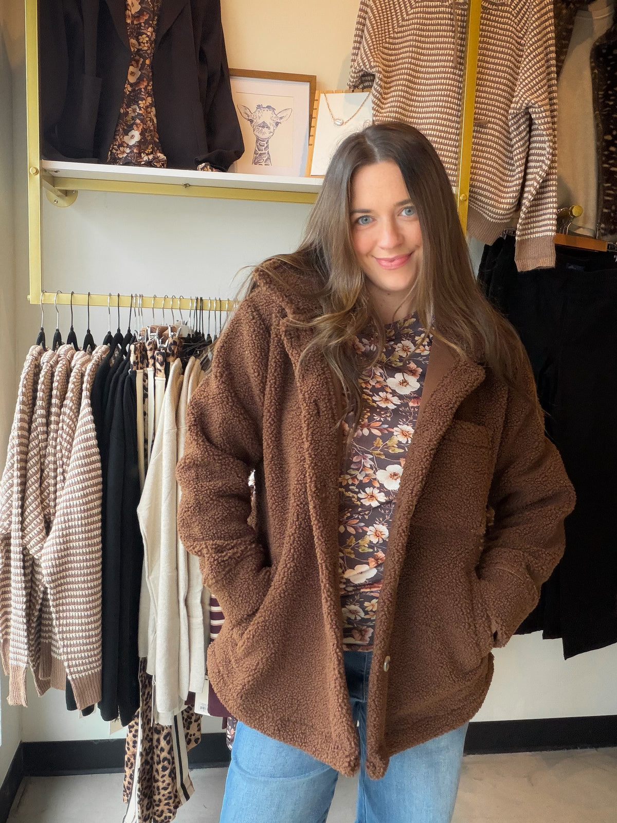 Bring a little cozy charm to your outerwear lineup with the Chocolate Brown Teddy Jacket by Michelle Mae. Its teddy-inspired style and rich chocolate brown color give everyday outfits a welcoming, seasonal feel, while a fleece-lined interior adds an extra cozy touch. It’s a lovely finishing layer for denim days, casual outings, and all those moments when you want your outfit to feel as inviting as your plans.

Picture a crisp afternoon, a warm drink in hand, and a little time to wander your favorite shops. 