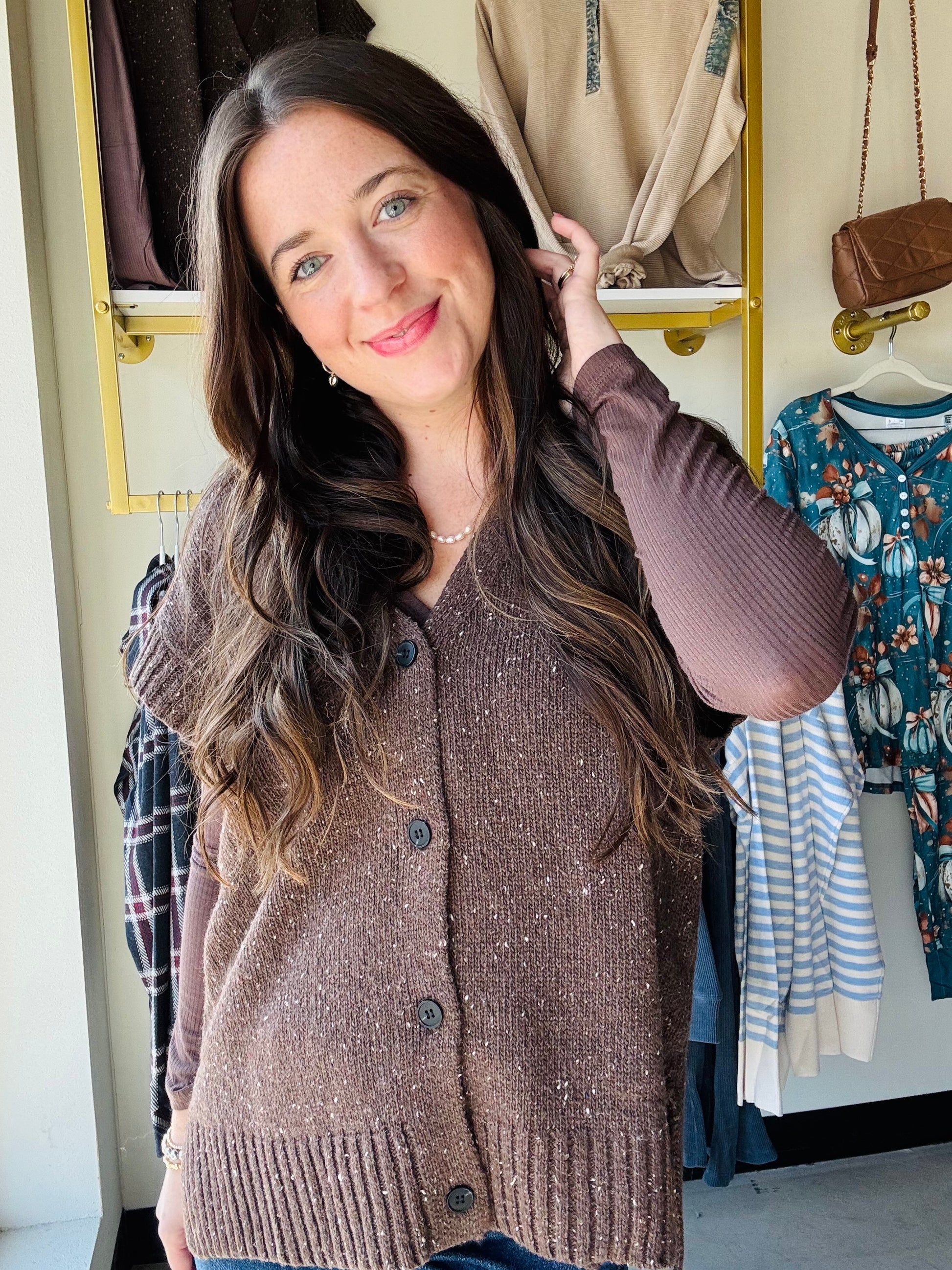 Mustard Seed&nbsp;

Get cozy and cute with this Dark Chocolate Sweater Vest! Featuring functioning buttons and playful cap sleeves, it’s perfect for layering any outfit. The ribbed detailing adds a fun texture twist while keeping things comfy and stylish. Perfect for when you want a little warmth with a lot of charm.