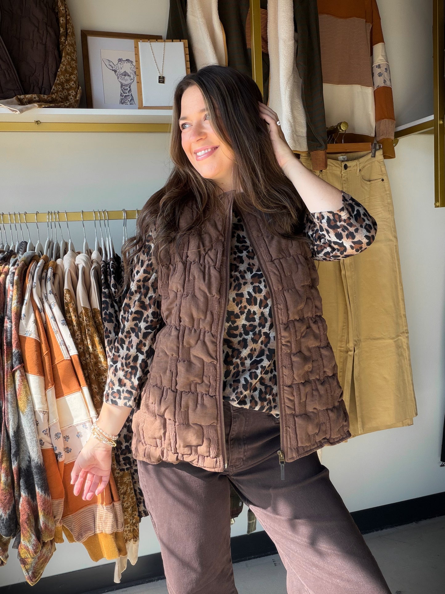 Layer up in style. The Brown Chunky Textured Vest by Creation is a wardrobe essential that brings cozy, elevated texture to any outfit — no sleeves needed.

The rich chunky knit-inspired texture and warm brown tone make this vest incredibly versatile — throw it over a turtleneck, a long-sleeve tee, or a button-down for an effortlessly put-together look. A perfect transitional piece from season to season.

Chunky textured fabrication
Sleeveless silhouette
100% Polyester
Available in sizes S–XXL
Sophie is wea