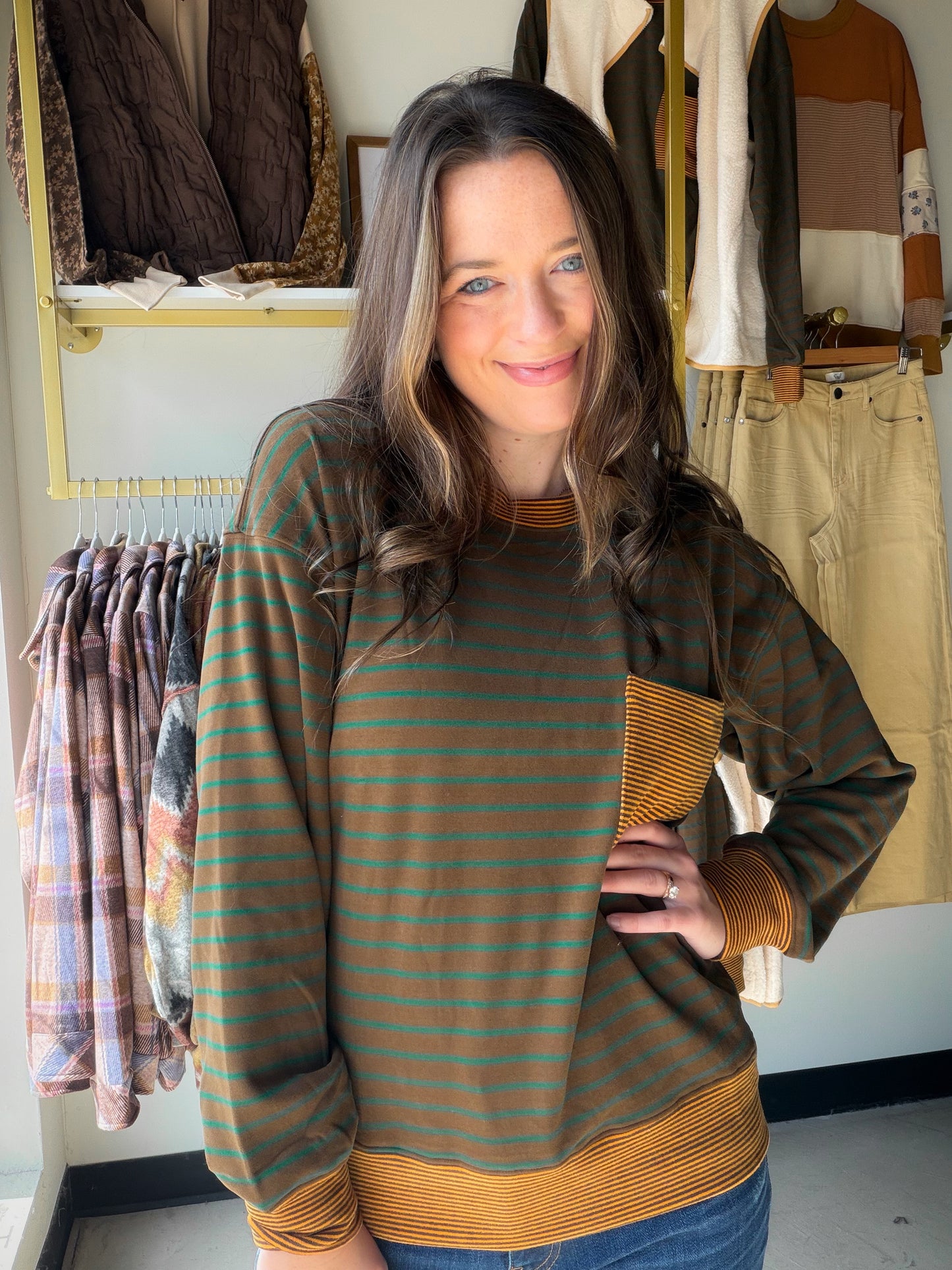 Your new weekend essential. The Cocoa Brushed Stripe Pocket Crewneck by Staccato combines cozy micro-brushed fabric with a subtle stripe mix-media design for a look that's relaxed but anything but basic.

Featuring a classic crewneck silhouette, long sleeves, a chest pocket, and color-trimmed details, this sweatshirt layers beautifully over your favorite tee or under a vest. The soft brushed texture makes it a go-to for cool days when comfort is non-negotiable.

Crewneck silhouette with color trim
Chest poc