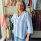 Dash

A breezy essential for warm-weather days, this lightweight gauze button-up features a classic vertical stripe pattern in calming blue tones. The three-quarter sleeves offer the perfect balance of coverage and breathability, while the soft gauze fabric drapes beautifully against the skin. Effortlessly versatile—wear it solo on lazy afternoons or layer it over a tank for added dimension. Perfect for casual outings, beach trips, or relaxed weekend wear.
