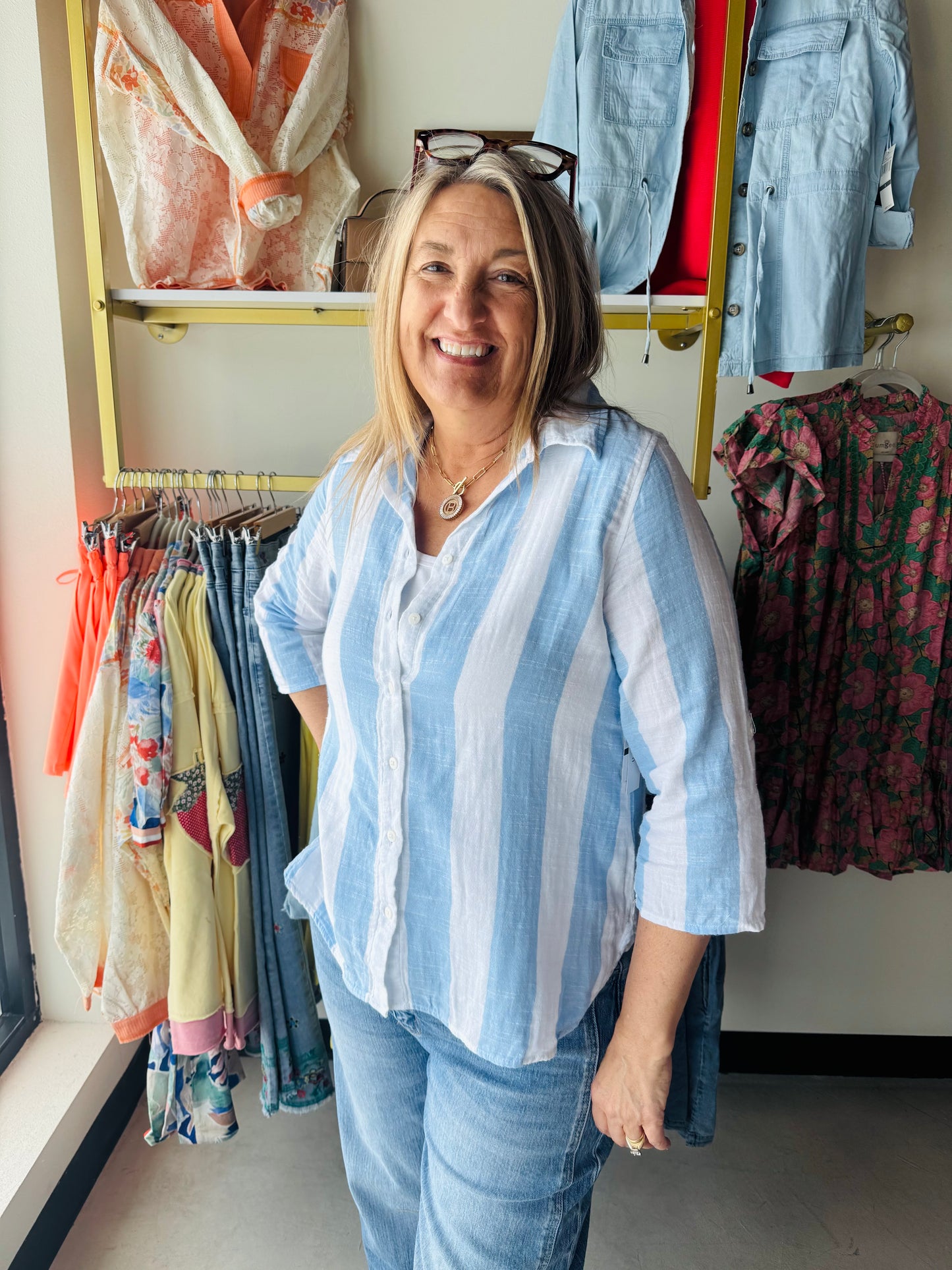 Dash

A breezy essential for warm-weather days, this lightweight gauze button-up features a classic vertical stripe pattern in calming blue tones. The three-quarter sleeves offer the perfect balance of coverage and breathability, while the soft gauze fabric drapes beautifully against the skin. Effortlessly versatile—wear it solo on lazy afternoons or layer it over a tank for added dimension. Perfect for casual outings, beach trips, or relaxed weekend wear.