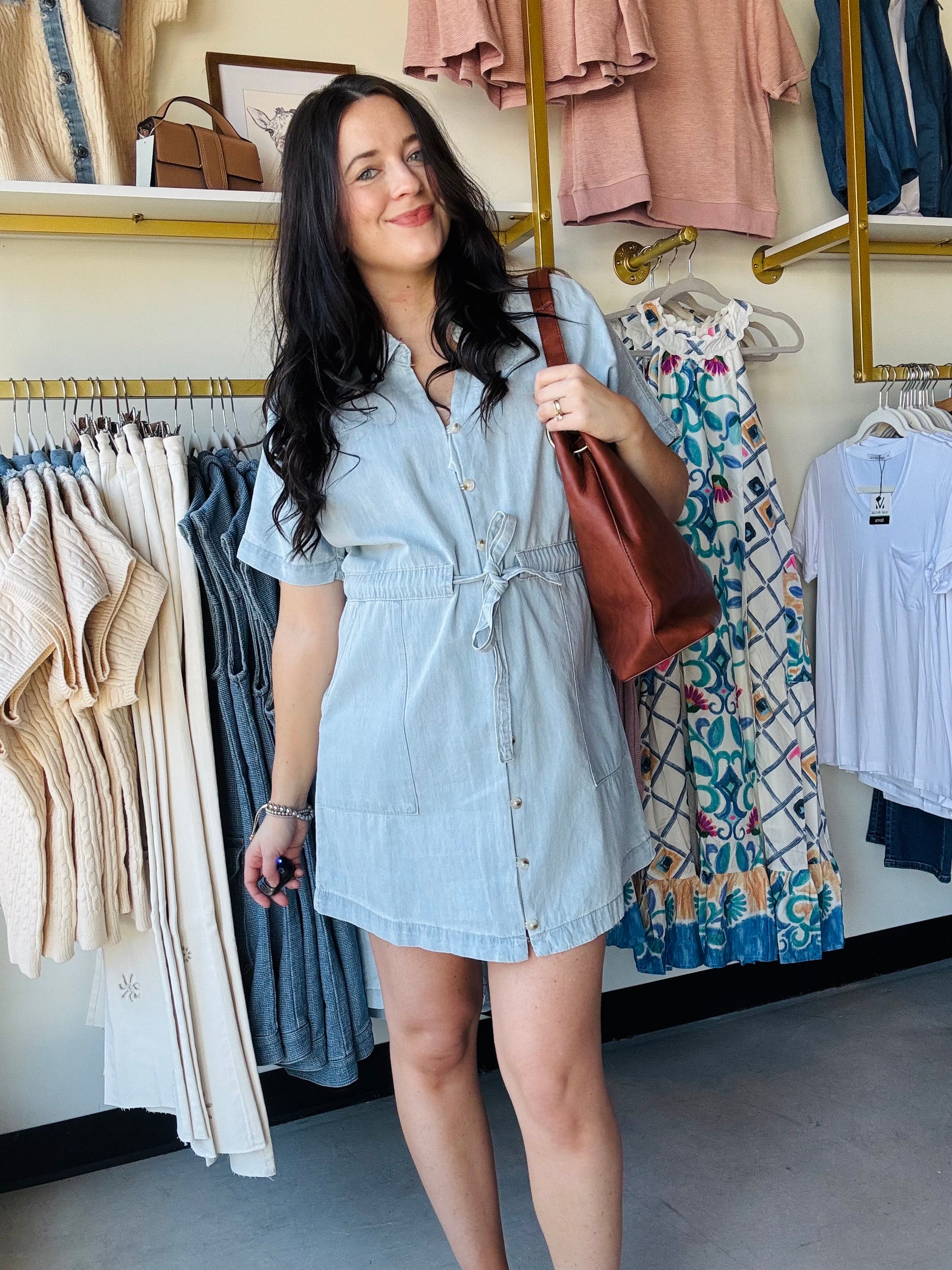 Wishlist&nbsp;

Elevate your casual wardrobe with this classic collared denim mini dress. Featuring functional buttons down the front, a flattering self-tie waist for a customizable fit, and practical side pockets for everyday convenience. The timeless denim construction pairs effortlessly with sneakers or heels, making it a versatile staple for any season. Perfect for weekend outings, casual dates, or laid-back office vibes.