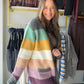 Let your layers do the talking. The Jewel Tone Color Block Cardigan by Staccato brings a mix of rich color to an easy open-front silhouette. Throw it over a simple tee for errands or over a dress when you want a cozy-looking splash of color.

Details to love

Multicolor, color-blocked design.
Open front and long sleeves for effortless layering.
Patch pockets for a practical finishing touch.
Fabric: 85% acrylic, 12% nylon, 3% spandex.
Fit &amp; styling

Sophie is wearing the Small. Available in Small, Medium