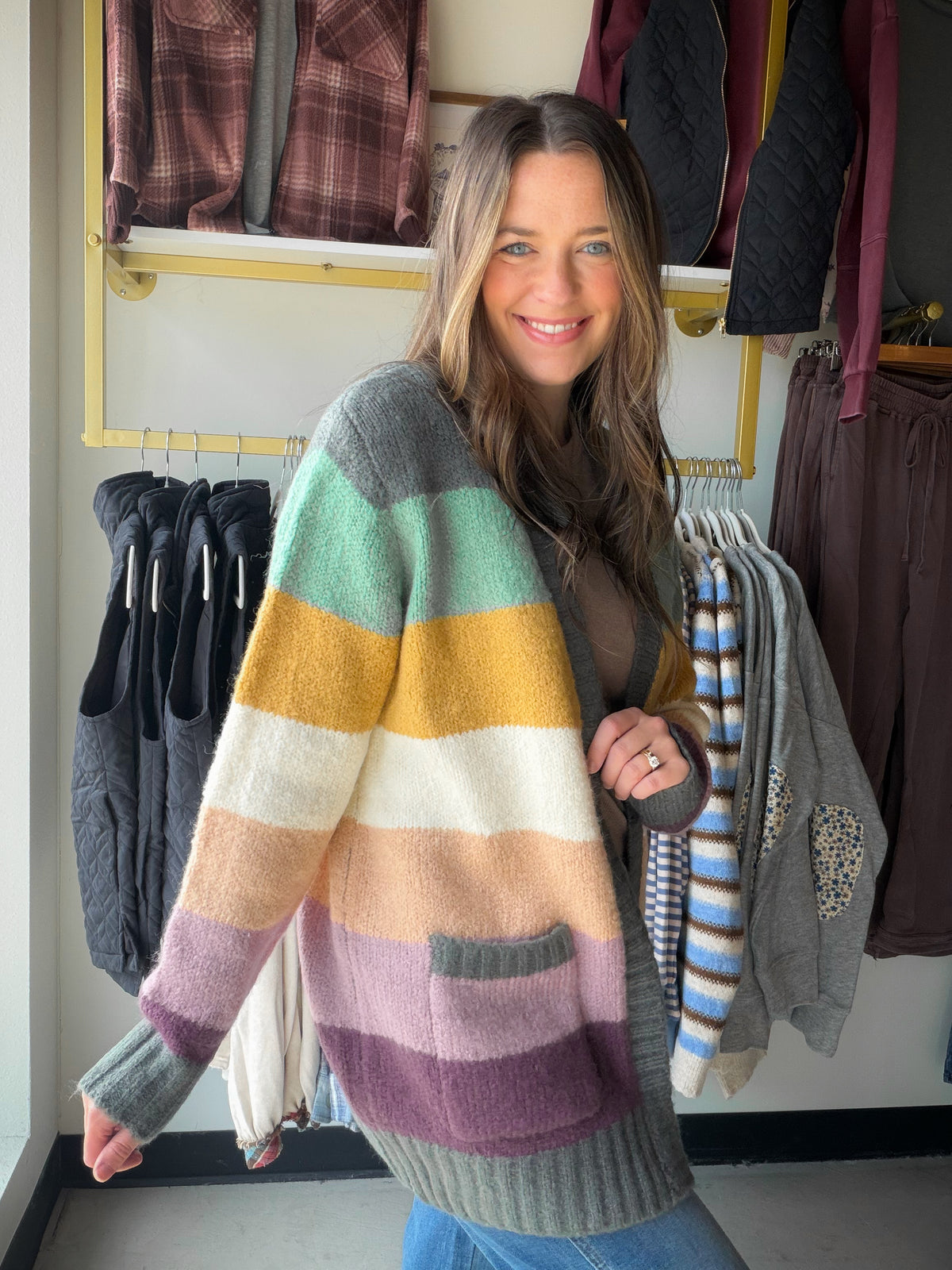 Let your layers do the talking. The Jewel Tone Color Block Cardigan by Staccato brings a mix of rich color to an easy open-front silhouette. Throw it over a simple tee for errands or over a dress when you want a cozy-looking splash of color.

Details to love

Multicolor, color-blocked design.
Open front and long sleeves for effortless layering.
Patch pockets for a practical finishing touch.
Fabric: 85% acrylic, 12% nylon, 3% spandex.
Fit &amp; styling

Sophie is wearing the Small. Available in Small, Medium