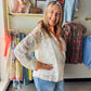 POL

Effortless elegance meets casual comfort in this V-neck lace top. Crafted from delicate lace with charming floral print patches, it features a relaxed fit that drapes beautifully. The front pocket adds practical style, while placket detailing and outseam accents enhance the design. Raw-edge and cut details give it an intentionally undone look that feels modern and laid-back. Perfect for layering over a basic white cami, this top transitions seamlessly from your work day to a beach vacay!