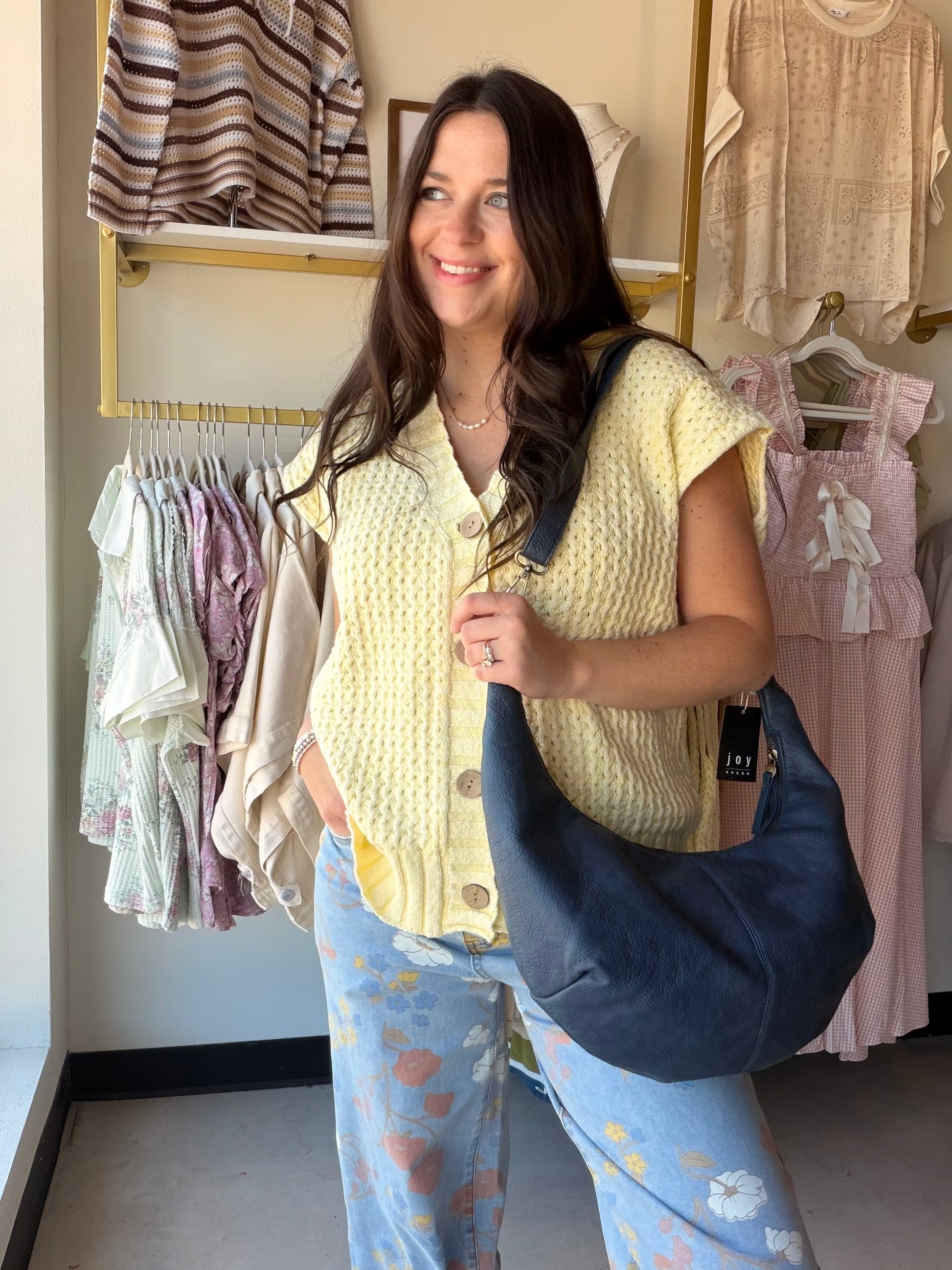 The it-piece your wardrobe has been waiting for. The Lemon Distressed Sweater Vest by Cotierra brings effortless cool-girl energy with its bold oversized silhouette and lived-in distressed detailing. A button-front, V-neckline, and sleeveless design make it endlessly versatile — layer it over a fitted tee and denim for a casual daytime look, or wear it as a statement piece on its own.

Details:

Distressed knit texture for a relaxed, vintage-inspired feel
Button-front closure
V-neckline
Sleeveless vest silh