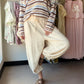 Breezy, relaxed, and effortlessly chic — the Natural Capri Lantern Pants by Cotierra are your warm-weather wardrobe staple. The lantern silhouette features a wide leg through the calf that tapers to a gathered ankle, creating a flattering, fashion-forward shape. A crinkle-textured fabric adds laid-back bohemian character, while the elastic drawstring waist keeps things comfortable and adjustable all day long.

Details:

Lantern-style silhouette — wide through the calf, tapered at the ankle
Capri length for 