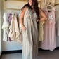 Cozy Co.

Embrace effortless warm-weather style with this sleeveless midi dress. Designed with a flattering V-neckline and a chic front-twist detail at the waist, it creates beautiful draping down the skirt. The vertical striped pattern elongates the silhouette, while practical side pockets add a casual, functional touch. Perfect for resort getaways or weekend brunches.
