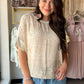 Casual, cool, and full of character — the Oatmeal Bandana Patch Top by Cozy Co. is a laid-back essential with a playful Western-inspired twist. The warm oatmeal base is elevated by a bandana patch detail in a contrast fabric, giving this short sleeve knit top a unique, boutique-worthy look that pairs effortlessly with denim, shorts, or your favorite wide-leg pants.

Details:

Bandana patch contrast detail
Short sleeve silhouette
Relaxed, easy-wearing fit
Lightweight and breathable construction
Material:
Sel