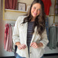 A layer that does the talking. The Cream Fringe Roll Tab Jacket brings effortless boho-chic style with playful fringe detailing and practical roll-tab sleeves you can adjust to the moment. The soft cream colorway makes it endlessly versatile — throw it over a sundress, a tank and jeans, or anything in between.

Fringe hem and detail for a boho-inspired finish
Roll-tab sleeves for adjustable styling
Soft cream colorway — pairs with everything
Lightweight layering piece
Available in sizes S–1X