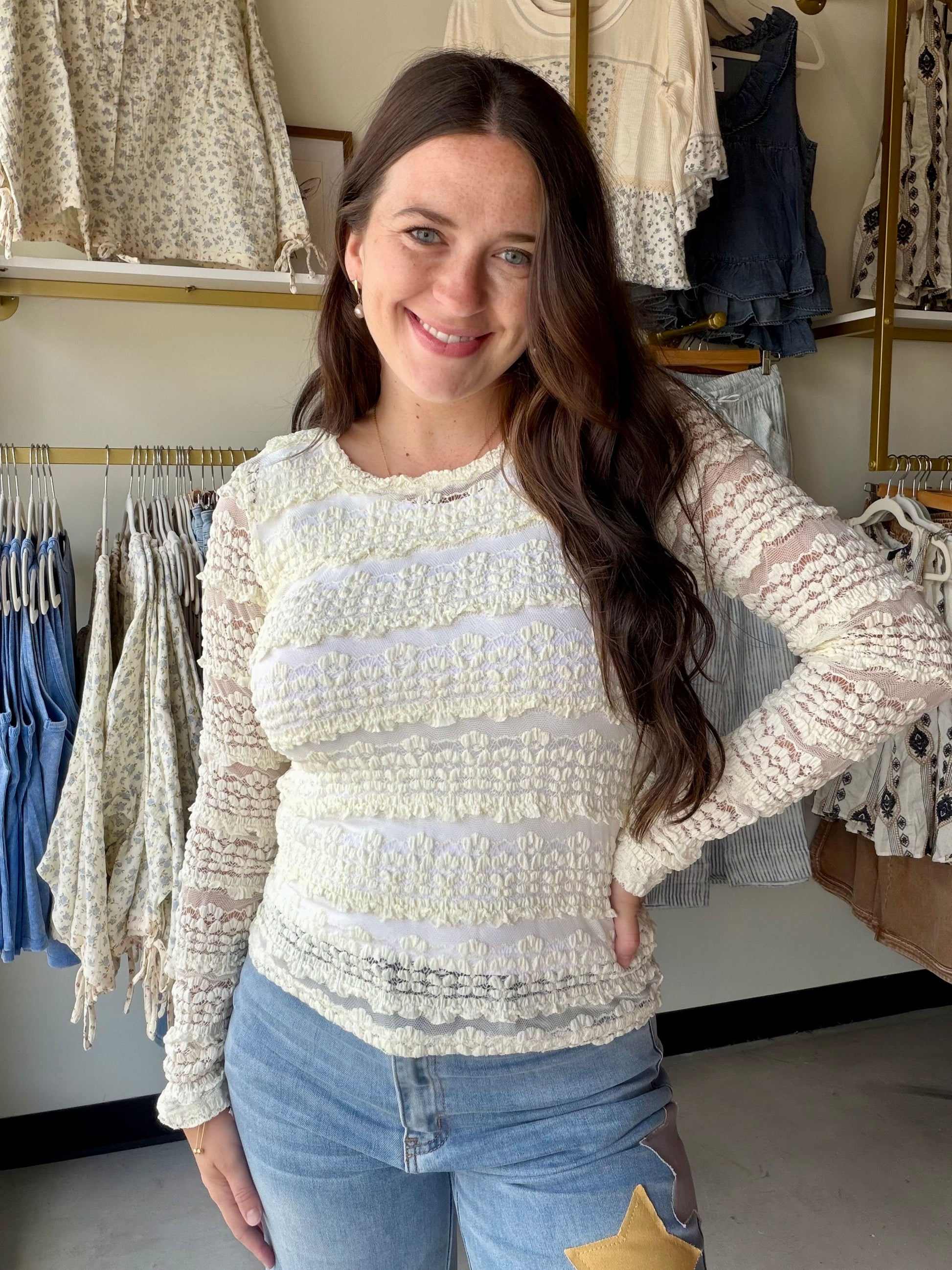 Bibi

Feminine, flirty, and just the right amount of romantic. The Ruffle Flower Lace Top is a long sleeve woven top that brings the prettiest details — delicate flower lace and ruffle accents that feel special without being over the top.

The stretch-blend fabric keeps it comfortable and easy to move in all day, while the lace and ruffle detailing elevates it well beyond your average top. Wear it tucked into high-waisted denim for a polished daytime look, or let it flow loose for an effortless, boho-inspir