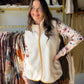 Soft, cozy, and effortlessly chic. The Cream Sherpa Accent Vest by Creation is the layering piece your fall and winter wardrobe has been waiting for.

Featuring plush sherpa accents in a warm cream tone, this vest adds instant texture and dimension to any look. Style it over a fitted long-sleeve, a flannel, or your favorite denim for a cozy-meets-polished vibe that works from errands to evenings out.

Sherpa accent detailing
Sleeveless silhouette
100% Polyester
Available in sizes S–XXL
Sophie is wearing the