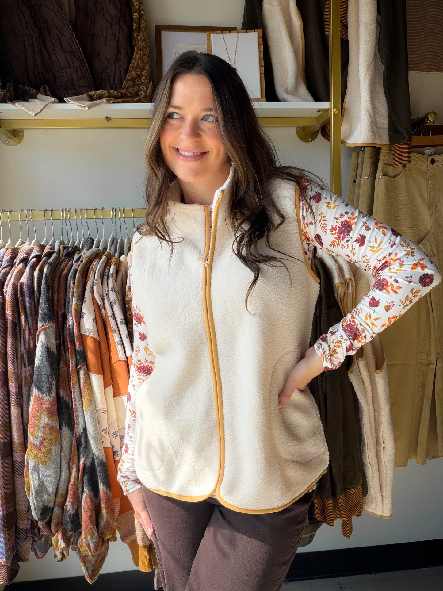 Soft, cozy, and effortlessly chic. The Cream Sherpa Accent Vest by Creation is the layering piece your fall and winter wardrobe has been waiting for.

Featuring plush sherpa accents in a warm cream tone, this vest adds instant texture and dimension to any look. Style it over a fitted long-sleeve, a flannel, or your favorite denim for a cozy-meets-polished vibe that works from errands to evenings out.

Sherpa accent detailing
Sleeveless silhouette
100% Polyester
Available in sizes S–XXL
Sophie is wearing the