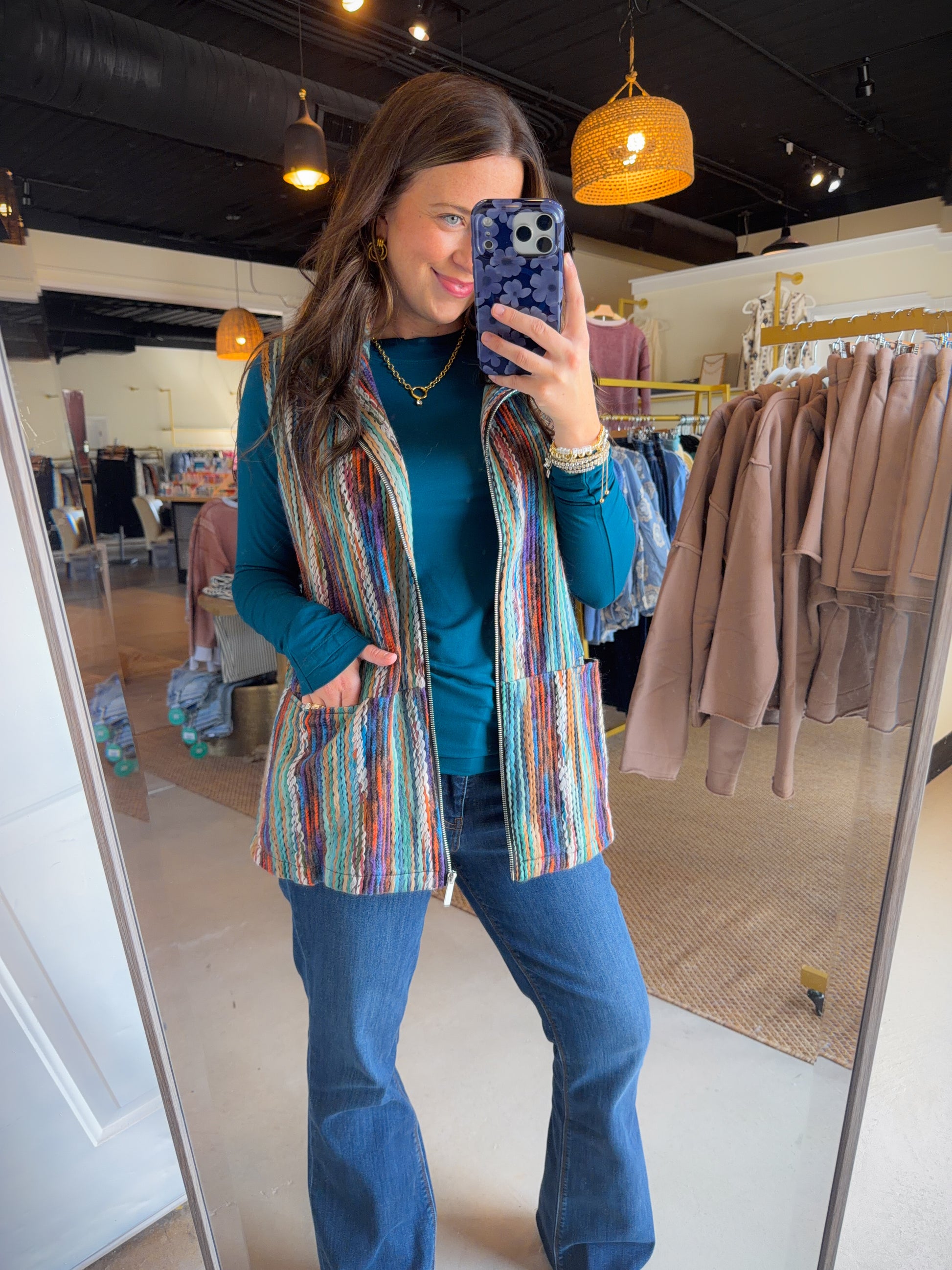Make a statement without saying a word. The Multi Vibrant Yarn Vest by Creation is a head-turning layer featuring rich, multicolor yarn detail that adds instant texture and personality to any outfit. The zip-up front and handy pockets make it as practical as it is eye-catching — throw it over a tee or turtleneck and you're ready to go.

Vibrant multicolor yarn detail throughout
Zip-up front with pockets
Lined for a polished finish
Self &amp; Lining: 100% Polyester
Available in S, M, L, XL, XXL