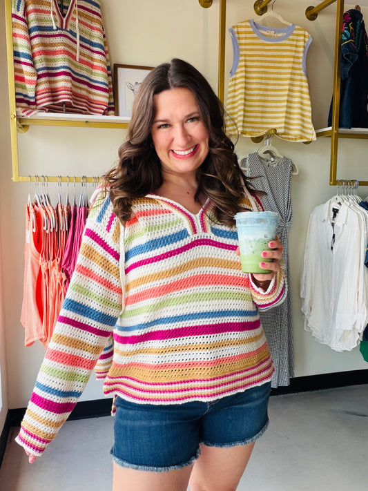 Cozy meets crafted. The Golden Multi Stripe Crochet Hoodie by Wishlist is a statement piece that brings boho texture and warm golden tones together in one effortlessly cool look. The open crochet construction adds breathable, lightweight warmth, while the multi-stripe pattern gives it a playful, artisan feel that stands out from the basics.

The hoodie silhouette keeps it relaxed and casual — perfect layered over a bralette or fitted tank for a festival-ready look, or thrown over a tee for an easy weekend o
