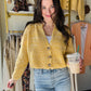 Brighten up your spring wardrobe with this sunshine yellow cropped sweater. The v neckline and functioning buttons add flair to this playful and versatile piece. Perfect for pairing with denim or dressing up over a dress or skirt.

Sadie &amp; Sage&nbsp;