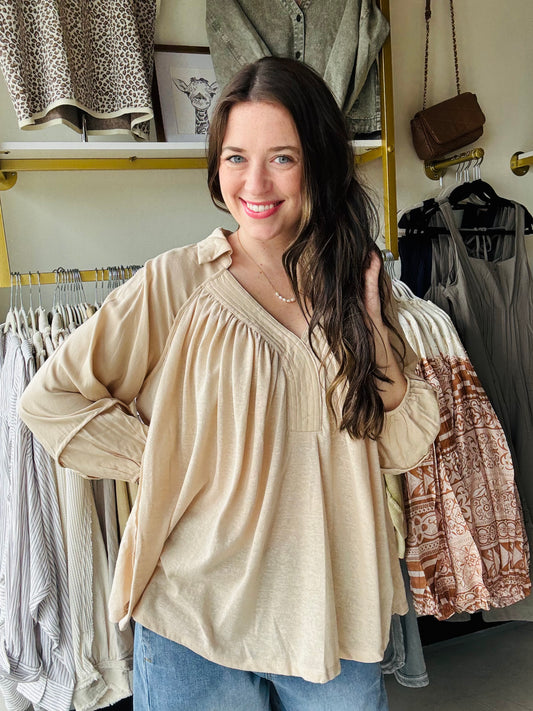 Expertly crafted, this Ecru Woven Flowy Top is a wardrobe staple. The neutral color allows for easy styling while the v neck with collar detail adds a touch of sophistication. The flowy and flattering fit provides both comfort and style. Perfect for any occasion.