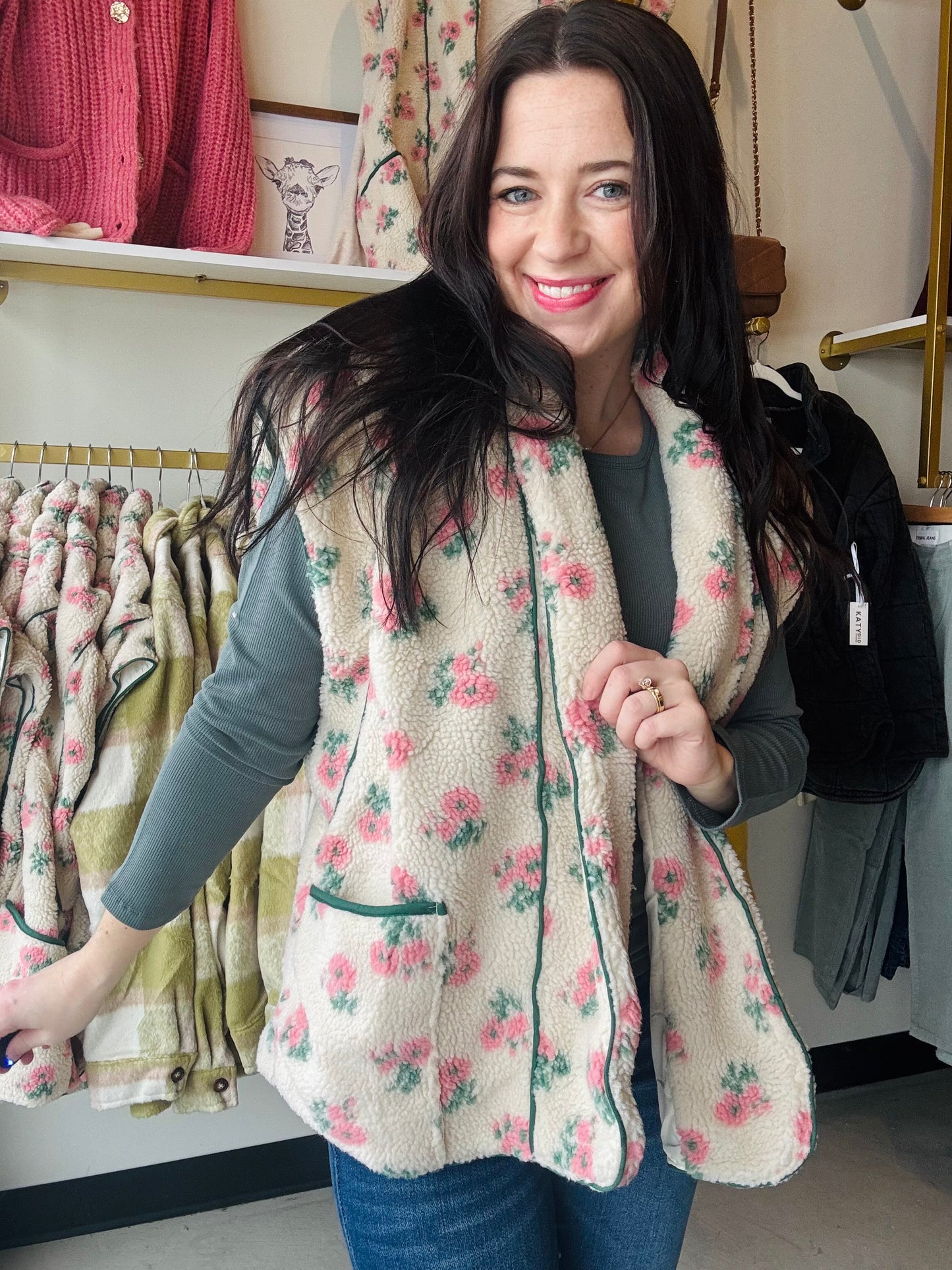 Bibi

Stay cozy and stylish with our Dainty Floral Fleece Vest. Featuring a beautiful floral print, drop shoulder design, and convenient patch pockets, this vest adds a touch of charm to your wardrobe. Perfect for layering, it's a must-have for cooler weather. Pairs well with our Stacy long sleeves and denim.&nbsp;