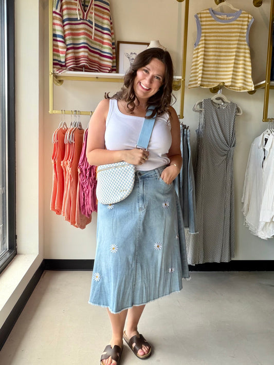 A little vintage, a little whimsical, and completely irresistible. The Daisy Embroidered Denim Skirt by Anniewear combines the timeless appeal of vintage-washed denim with delicate daisy flower embroidery for a look that feels both nostalgic and fresh.

The A-line silhouette and knee-length midi cut are universally flattering, while the comfort stretch and 5-pocket design keep it as practical as it is pretty. The raw finish edge and zipper front closure add just the right amount of edge to balance out the f