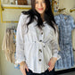 Effortless layering meets timeless style with this linen tie waist jacket. Featuring cuffed sleeves, warm brown buttons, and a flattering tie waist design, it transitions seamlessly from open draping to buttoned sophistication. Perfect for adding dimension to any outfit while keeping you cool and comfortable in natural linen fabric.