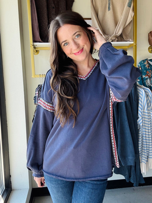 Easel

Embrace cozy vibes with this Navy Embroidered Trim Hoodie. Its relaxed, oversized fit and dropped shoulders ensure endless comfort, while the multicolor ethnic trim adds a fun pop of color. The attached hood tops off this laid-back look, perfect for playful days and chilly nights.