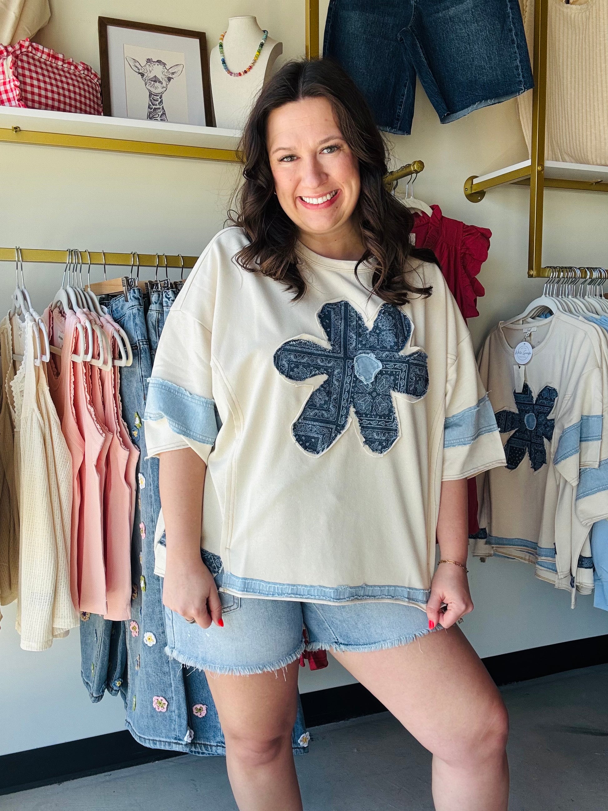 Easel

Elevate your casual wardrobe with this artistic Easel terry top, featuring a bold bandana patchwork daisy and vintage-inspired denim accents. The relaxed, oversized silhouette delivers effortless boho-chic style while ensuring premium, all-day comfort

Effortless, relaxed oversized silhouette.
Bold bandana patchwork floral appliqué.
Vintage-inspired contrast denim detailing.
Ultra-soft, premium washed terry fabric.
Chic dropped shoulders; 3/4 sleeves.
Unique, hand-crafted boutique aesthetic.