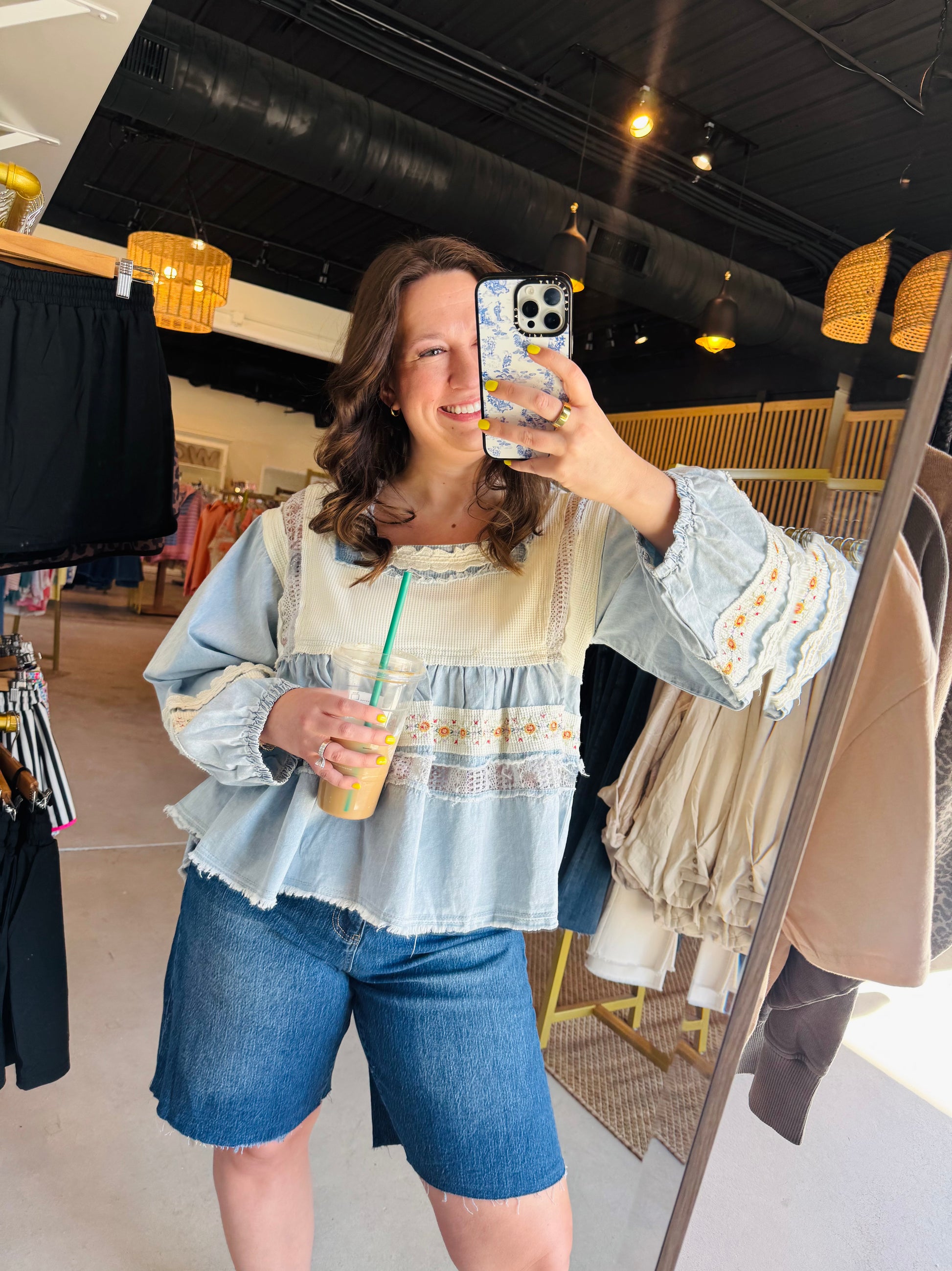 POL

Embrace effortless romance with this square-neck denim blouse featuring delicate lace panels and vintage-inspired floral embroidery. The lightweight, tiered ruffle silhouette offers a breezy, relaxed fit designed for everyday elegance and feminine movement.

Soft, romantic boho-chic aesthetic.
Intricate lace and floral embroidery.
Breathable, lightweight textured woven fabric.
Flattering, flowy tiered babydoll silhouette.
Unique raw-edge vintage detailing.
Effortless styling for any occasion.
