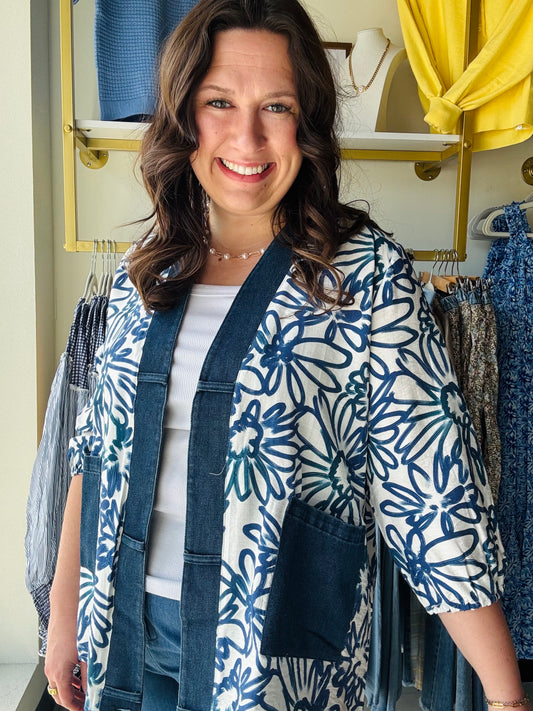 Creations

Merge artistic indigo florals with rugged denim accents for a standout, high-impact layer. This breezy kimono-style cardigan features functional pockets and a relaxed silhouette, perfect for effortless day-to-night styling.

Chic denim trim adds modern edge.
Bold floral print for artistic flair.
Breezy fabric ensures all-day comfort.
Functional pockets for daily essentials.
Relaxed fit flatters every silhouette.
Versatile layering for any season.
