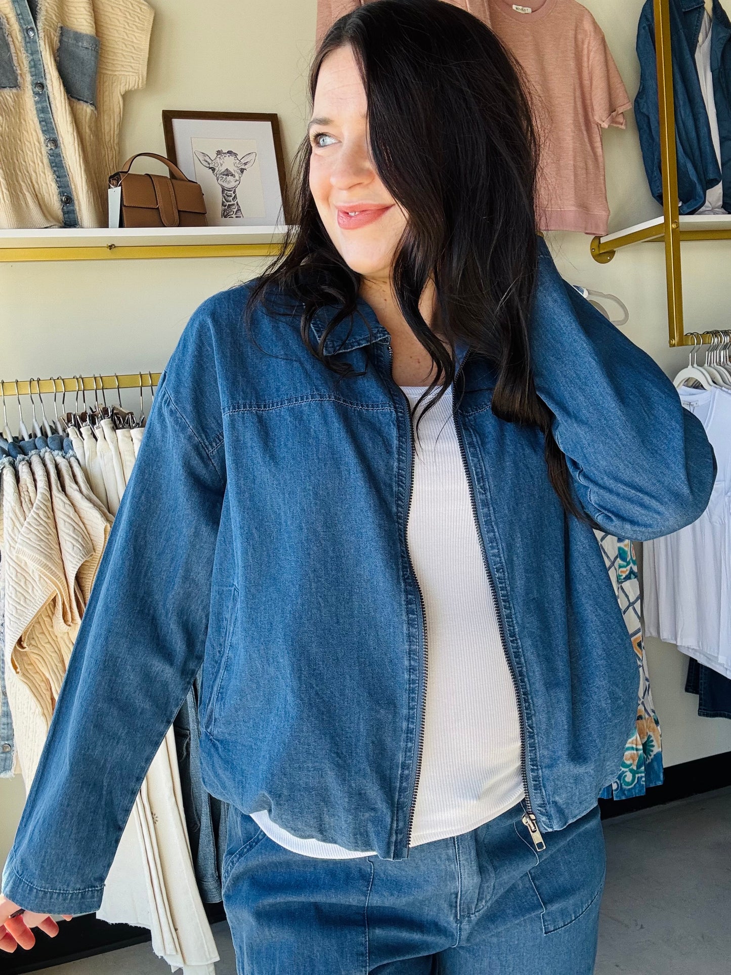Sunday Edition

Effortless style meets everyday comfort in this versatile denim jacket. Crafted from breathable, lightweight denim, it's perfect for layering during transitional seasons or wearing solo on mild days. The smooth-functioning zipper ensures easy on-and-off convenience, while the classic silhouette works with virtually any outfit in your wardrobe. Whether you're dressing up casual basics or adding structure to a relaxed look, this zip-up delivers timeless appeal without the bulk.