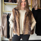 The Doe Print Faux Fur Vest by Comfy Luxe is the cozy layer your cold-weather closet has been waiting for. Plush faux fur in a sweet doe print adds warmth and a little woodland charm, while the easy vest silhouette slips right over your favorite long sleeves.

Picture it on a crisp Saturday morning, layered over a fitted tee for a coffee run, or tossed over a chunky knit for an evening bonfire with friends. It’s the kind of piece that makes a simple outfit feel pulled together.

Details to Love

Plush faux 