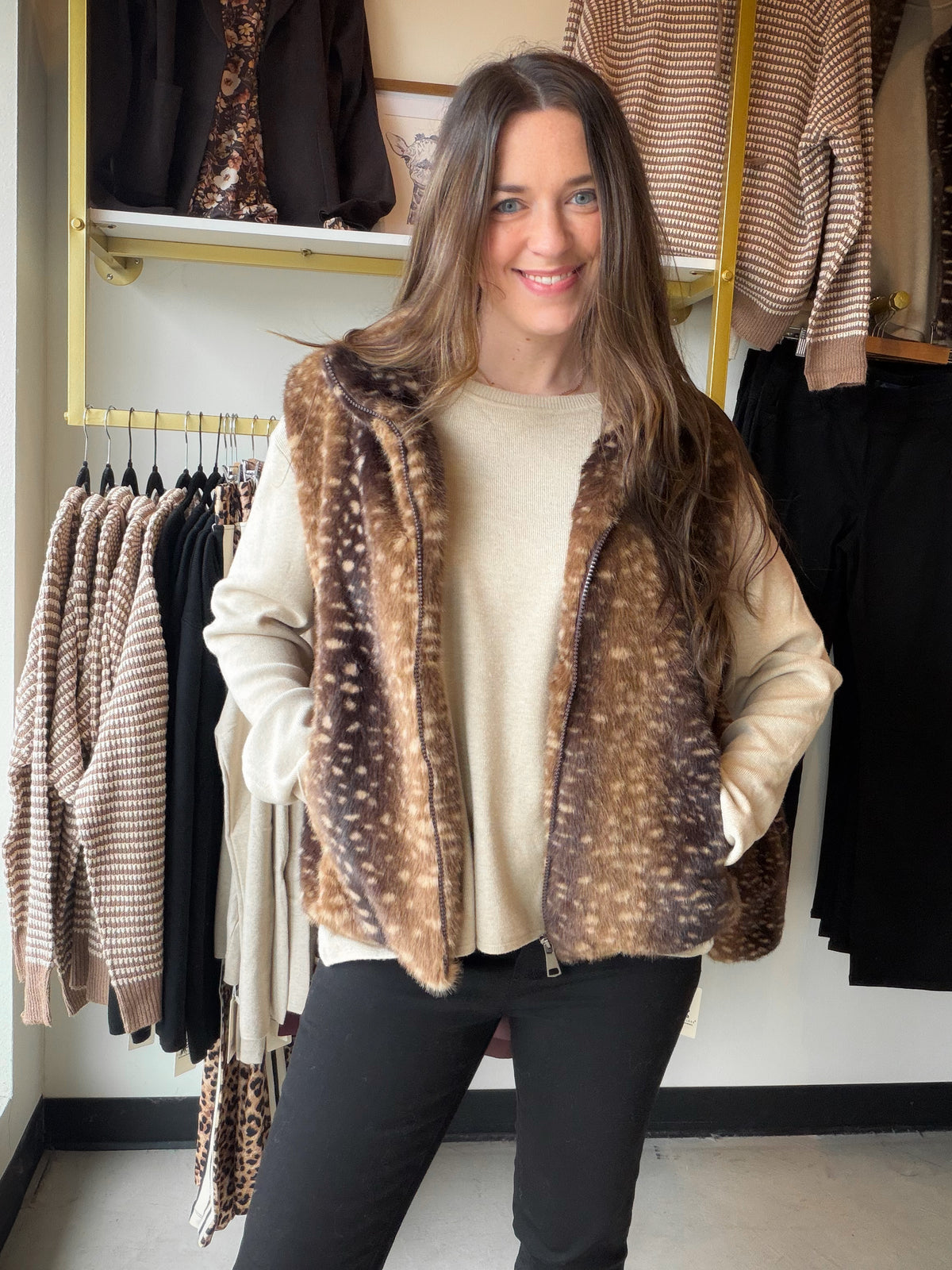The Doe Print Faux Fur Vest by Comfy Luxe is the cozy layer your cold-weather closet has been waiting for. Plush faux fur in a sweet doe print adds warmth and a little woodland charm, while the easy vest silhouette slips right over your favorite long sleeves.

Picture it on a crisp Saturday morning, layered over a fitted tee for a coffee run, or tossed over a chunky knit for an evening bonfire with friends. It’s the kind of piece that makes a simple outfit feel pulled together.

Details to Love

Plush faux 