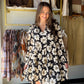 Turn heads in this dreamy floral mini from&nbsp;Doe &amp; Rae. A split V-neckline with tassel tie, long sleeves with ruffle trim, and a tiered skirt that moves beautifully — this dress does all the work for you. Wear it to brunch, a night out, or anywhere you want to feel effortlessly put-together.

Bold black &amp; white floral print with a feminine, editorial feel
Split V-neckline with tassel tie closure for a flirty, boho touch
Long sleeves with ruffle trim — elegant and season-spanning
Tiered mini skirt