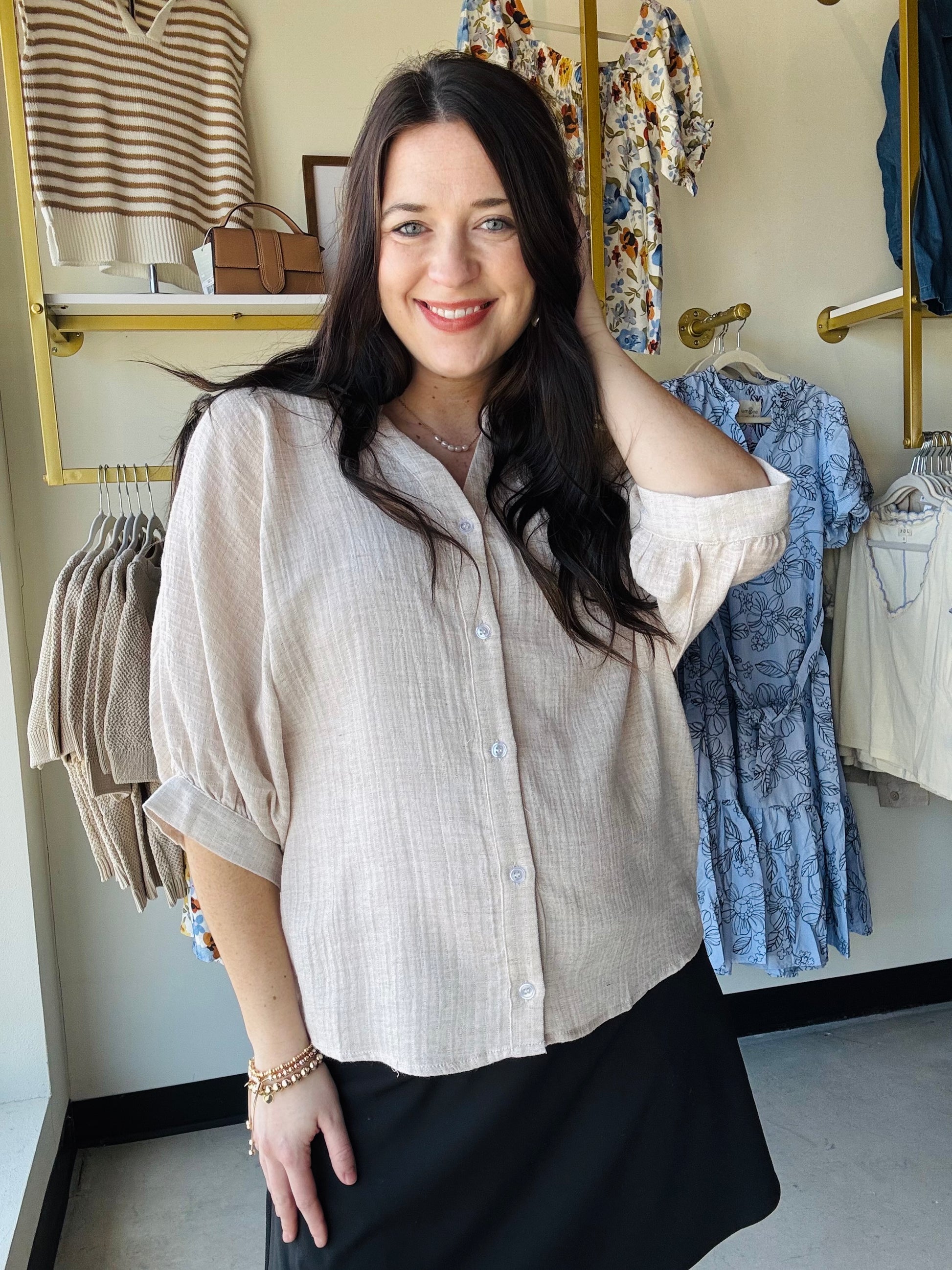 Elevate your casual wardrobe with this versatile dolman sleeve button-up shirt. Crafted from a lightweight linen-like gauze fabric, it offers breathable comfort perfect for warm weather styling. The relaxed elbow dolman sleeves provide an effortless, flattering silhouette, while the classic china collar and pinstriped pattern add timeless sophistication. Layer it over basics or wear solo for an understated, polished look that transitions seamlessly from day to evening.