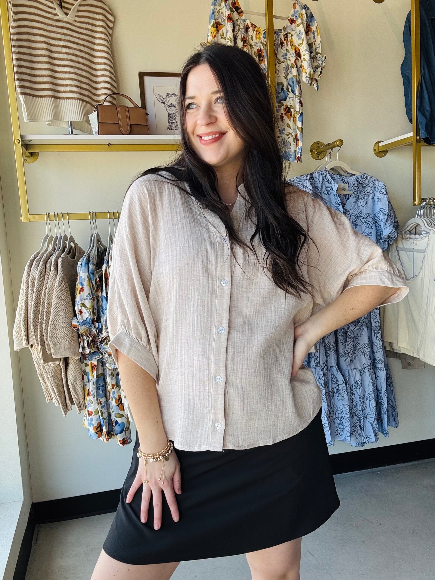 Elevate your casual wardrobe with this versatile dolman sleeve button-up shirt. Crafted from a lightweight linen-like gauze fabric, it offers breathable comfort perfect for warm weather styling. The relaxed elbow dolman sleeves provide an effortless, flattering silhouette, while the classic china collar and pinstriped pattern add timeless sophistication. Layer it over basics or wear solo for an understated, polished look that transitions seamlessly from day to evening.