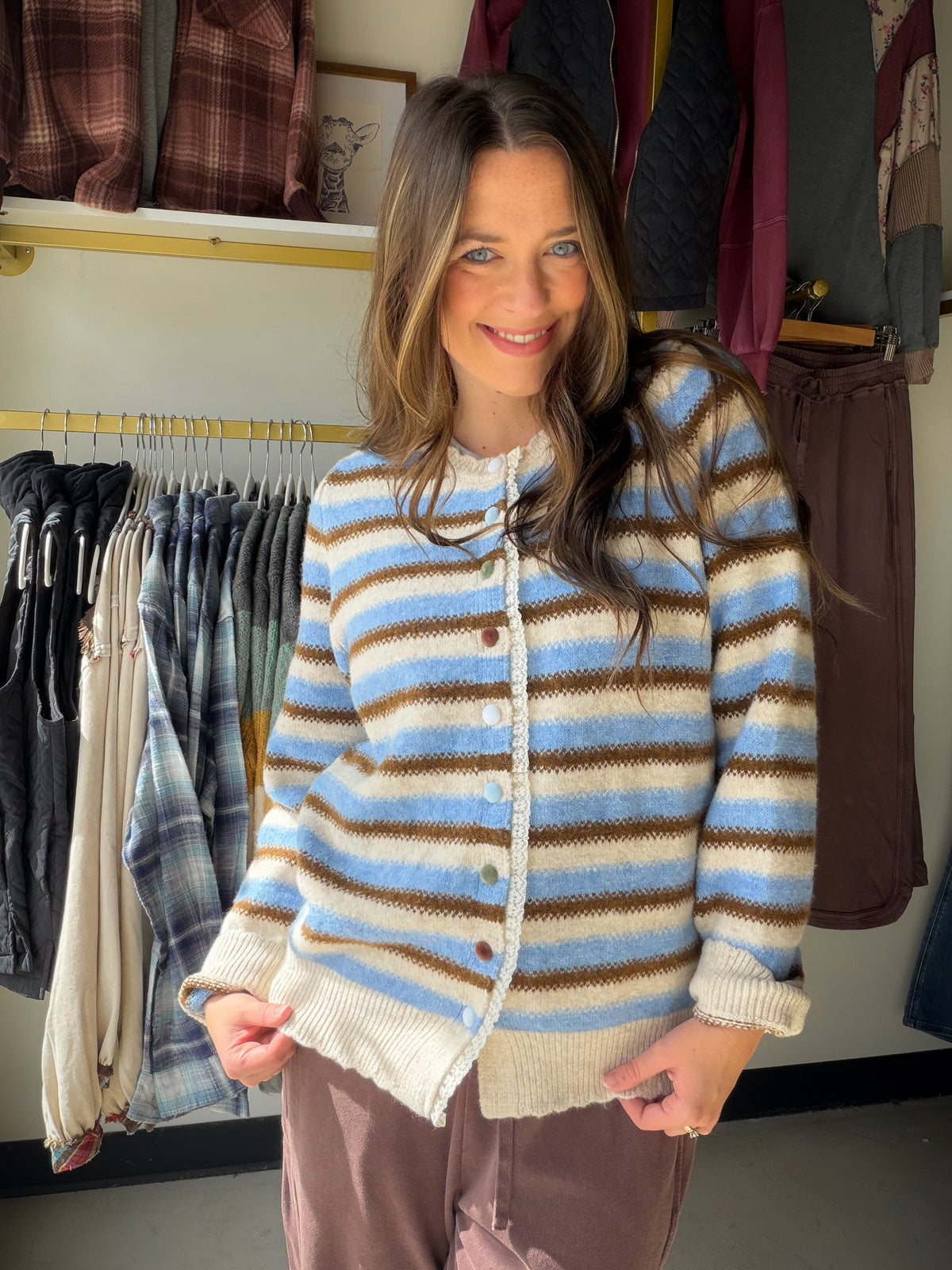 A little color, a lot of outfit potential

Meet the Brown &amp; Blue Striped Button Cardi by Easel. The brown-and-blue stripes bring a playful twist to a classic button-front layer, making it an easy piece to reach for when your outfit needs a little something extra.

Why you'll love it

Brown and blue stripes add color without being hard to style.
Button-front cardigan styling lets you wear it open or buttoned up.
Available in Small, Medium, and Large.
Style it your way

Picture it over your favorite tee w
