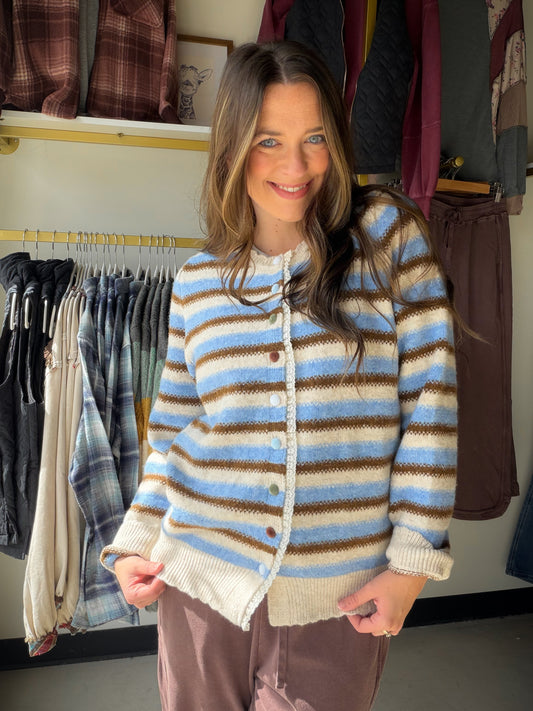 A little color, a lot of outfit potential

Meet the Brown &amp; Blue Striped Button Cardi by Easel. The brown-and-blue stripes bring a playful twist to a classic button-front layer, making it an easy piece to reach for when your outfit needs a little something extra.

Why you'll love it

Brown and blue stripes add color without being hard to style.
Button-front cardigan styling lets you wear it open or buttoned up.
Available in Small, Medium, and Large.
Style it your way

Picture it over your favorite tee w