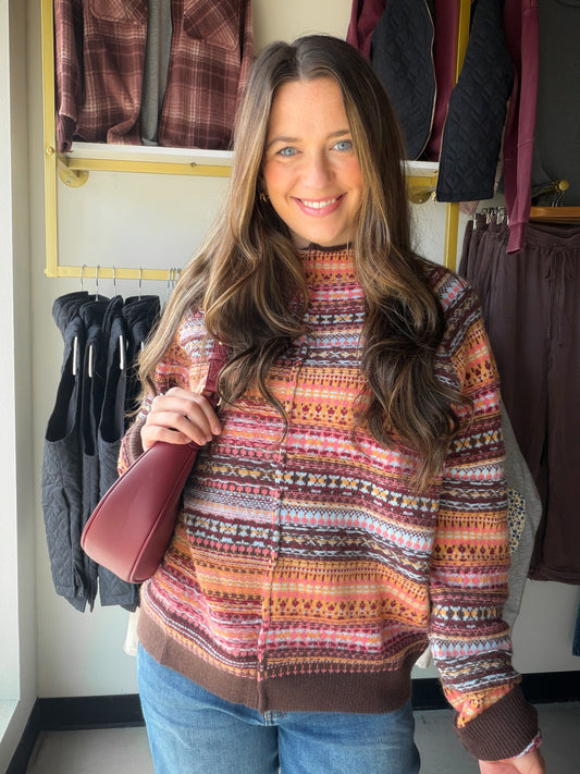 Warm peach meets earthy brown in a sweater that makes getting dressed feel easy. The Peach &amp; Brown Accent Sweater by Easel has a mock neckline that gives simple denim-and-boots days a polished little lift. Reach for it when you want your knitwear to carry the outfit.

What makes it special

Peach and brown accent color pairing.
Mock neckline, as listed in the existing product details.
By Easel.
Style it your way

Wear with dark denim to let the colors stand out, or pair with neutral trousers for a softe
