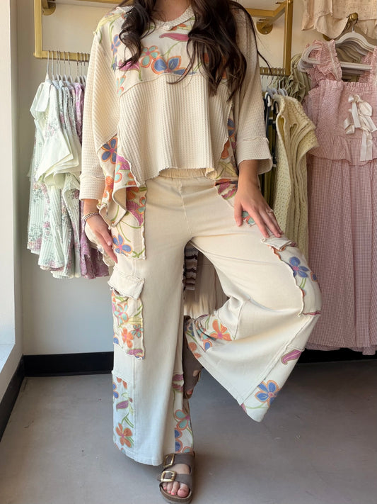 Floral Mix Terry Wash Pants

Meet your new favorite loungewear obsession. These relaxed wide-leg pants are crafted from soft, washed terry knit fabric in an all-over floral print — the kind of effortless piece you'll reach for again and again, whether you're running errands or unwinding at home.

Relaxed wide-leg silhouette
All-over floral print in washed terry fabric
Elastic waistband with adjustable drawstring
Side pockets + cargo-style detailing
100% Cotton knit — soft, breathable, and easy to wear
Part 