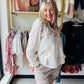 Rain + Rose

Embrace effortless romance with this lightweight bohemian top featuring intricate tonal floral embroidery and charming tassel details. Designed with an airy fit and feminine ruffle cuffs, it’s the perfect versatile piece for transitioning from sun-soaked days to elegant evenings.

Intricate floral embroidery for romantic detail.
Lightweight fabric ensures airy, breathable comfort.
Playful tassel-tie neck adds boho charm.
Elegant ruffle cuffs finish long sleeves.
Versatile design transitions day